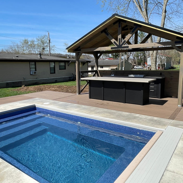 Stono Outdoor Living Engineered Outdoor Kitchen in backyard setting near pool