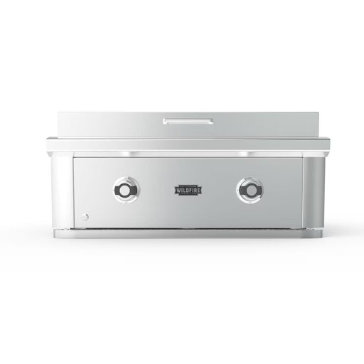 Stono Outdoor Living Front view of the Wildfire Outdoor Living Ranch Pro 30" Griddle 304 SS Propane (WFPRO30GRD-SS-LP) with two stainless steel burners, Wildfire logo in the center, closed lid—ideal for any outdoor kitchen setup.