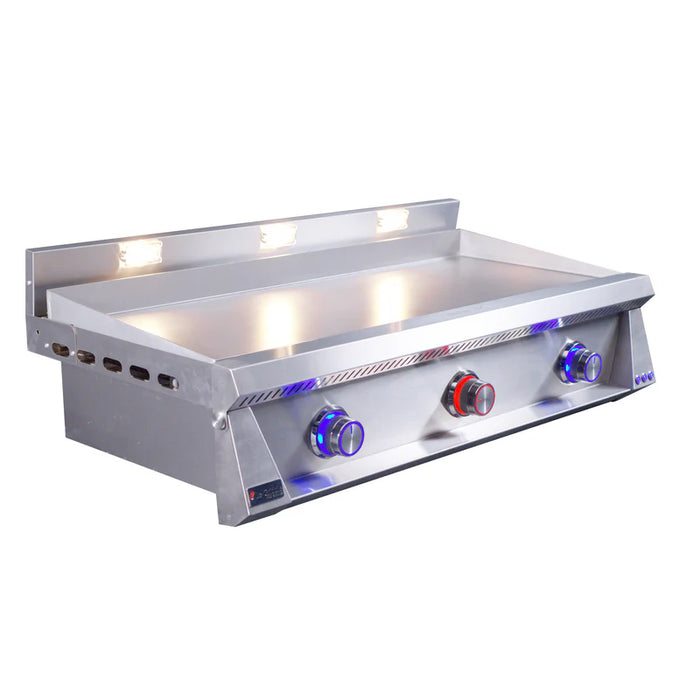 Stono Outdoor Living The Le Griddle Pro Series 105 (OML105P3) by Le Griddle is a 304 stainless steel, 3-burner natural gas griddle with a 3mm plate, interior lights, three control knobs, and a raised back panel—perfect for versatile outdoor cooking.