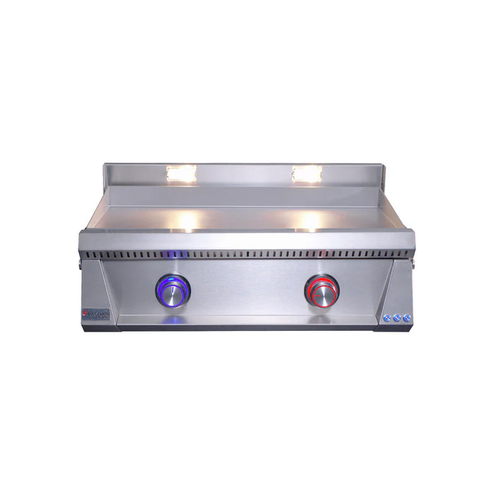 Stono Outdoor Living The Le Griddle Pro Series 75 - 2 Burner Natural Gas griddle (OML75P3) by Le Griddle features a sleek stainless steel design, a flat 3mm cooking plate, blue and red control knobs, and built-in interior lights for easy outdoor grilling.
