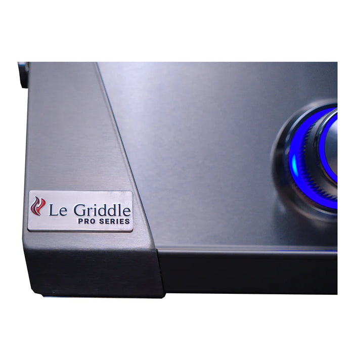 Stono Outdoor Living Close-up of the Le Griddle Pro Series 75 - 2 Burner Gas Griddle (OML75P3), featuring the brand logo and a blue-lit control knob on the right, plus interior lights and a 3mm stainless steel plate.