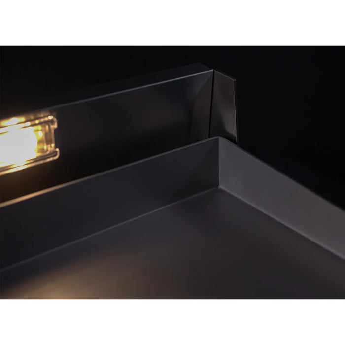 Stono Outdoor Living Close-up of the Le Griddle Pro Series 75 - 2 Burner Natural Gas (3mm plate, interior lights, OML75P3) with sharp matte black stainless steel edge, partially lit—ideal for any commercial gas griddle setup.