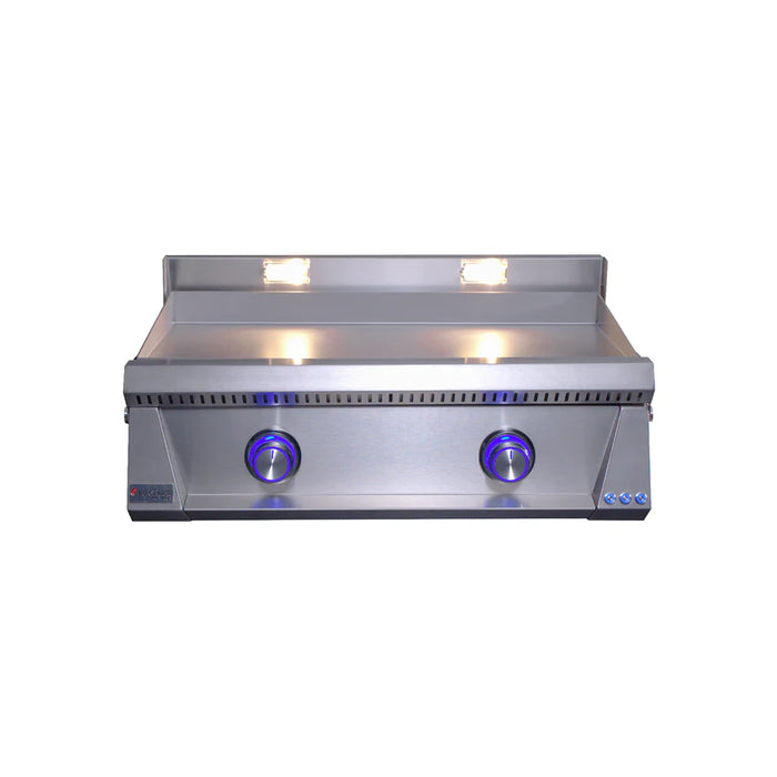 Stono Outdoor Living A Le Griddle Pro Series 75 (OML75P3) 2-burner natural gas griddle with a 3mm stainless steel plate, two blue-lit control knobs, and interior lights above the cooking area by Le Griddle, shown on a plain white background.
